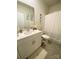 Well-lit bathroom features a single vanity and shower with tub at 3524 Tully Ave, Kannapolis, NC 28081