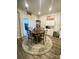 Round dining table with four chairs, a stylish rug, and access to a deck at 3524 Tully Ave, Kannapolis, NC 28081