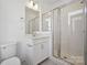 Modern bathroom featuring a glass shower, stylish vanity, and tiled walls at 455 Blairhill Rd # 03, Charlotte, NC 28217