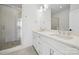 Modern bathroom featuring a double vanity with marble countertops and a glass-enclosed shower at 455 Blairhill Rd # 03, Charlotte, NC 28217