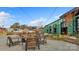 Inviting outdoor patio with gravel, firepit, string lights, seating and building, creating a modern and cool vibe at 455 Blairhill Rd # 03, Charlotte, NC 28217