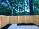 Private backyard with wooden fence and gate at 3178 Heathstead Pl, Charlotte, NC 28210