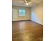 Spacious bedroom with hardwood floors and ceiling fan at 3178 Heathstead Pl, Charlotte, NC 28210