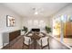 Bright dining area with fireplace and sliding glass doors leading to patio at 3178 Heathstead Pl, Charlotte, NC 28210