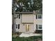 Tan two-story townhome with white shutters and a small front porch at 3178 Heathstead Pl, Charlotte, NC 28210