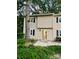 Tan townhome exterior with visible entrance and landscaping at 3178 Heathstead Pl, Charlotte, NC 28210