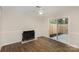 Cozy living room features a fireplace and sliding glass door leading to a private patio at 3178 Heathstead Pl, Charlotte, NC 28210