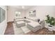 Spacious living room featuring a large sectional sofa and wood-look floors at 3178 Heathstead Pl, Charlotte, NC 28210