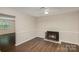 Living area with fireplace and dark hardwood floors at 3178 Heathstead Pl, Charlotte, NC 28210