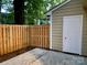 Small patio with storage shed and wooden fence at 3178 Heathstead Pl, Charlotte, NC 28210