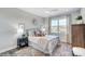 Cozy bedroom with striped bedding and ample natural light at 3245 Mcharney Dr # 28, Harrisburg, NC 28075