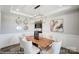 Modern dining room with a live-edge wood table and statement artwork at 3245 Mcharney Dr # 28, Harrisburg, NC 28075