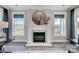 Marble fireplace with large circular mirror above in a living room setting at 3245 Mcharney Dr # 28, Harrisburg, NC 28075