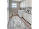 Bright laundry room with washer, dryer, and ample cabinet space at 3245 Mcharney Dr # 28, Harrisburg, NC 28075