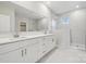 Elegant bathroom with double vanity, quartz countertops, and a large mirror at 117 Brooke Forest Ct, Mooresville, NC 28115