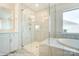 Elegant bathroom with a glass shower and soaking tub at 3221 Mcharney Dr # 31, Harrisburg, NC 28075