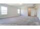 Bright bedroom featuring carpet, and access to a bathroom and another bedroom at 3221 Mcharney Dr # 31, Harrisburg, NC 28075