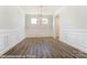 Formal dining room with elegant chandelier and hardwood floors at 3221 Mcharney Dr # 31, Harrisburg, NC 28075