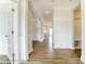 Hardwood floor hallway with white walls and doors at 3221 Mcharney Dr # 31, Harrisburg, NC 28075