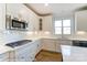 Modern kitchen featuring stainless steel appliances and white cabinetry at 3221 Mcharney Dr # 31, Harrisburg, NC 28075