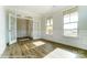 Bright living room with hardwood floors and French doors at 3221 Mcharney Dr # 31, Harrisburg, NC 28075