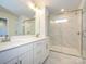 Modern bathroom with double vanity and a large shower at 10511 Boudreaux St, Huntersville, NC 28078
