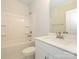 Clean bathroom with white vanity, bathtub, and shower at 10511 Boudreaux St, Huntersville, NC 28078