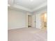 Spacious bedroom with carpet and access to hallway bathroom at 10511 Boudreaux St, Huntersville, NC 28078