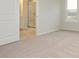 Carpeted bedroom with en-suite bathroom and window at 10511 Boudreaux St, Huntersville, NC 28078