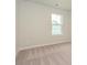 Simple bedroom with carpet, window, and neutral walls at 10511 Boudreaux St, Huntersville, NC 28078