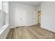 Bedroom with double doors, window, and access to a staircase at 10511 Boudreaux St, Huntersville, NC 28078