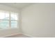 Bright bedroom with neutral carpet and a window at 10511 Boudreaux St, Huntersville, NC 28078