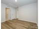 Spacious bedroom with hardwood floors and neutral walls at 10511 Boudreaux St, Huntersville, NC 28078