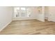 Bright dining area with hardwood floors and large windows at 10511 Boudreaux St, Huntersville, NC 28078