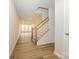 Light-filled entryway with staircase and view into living area at 10511 Boudreaux St, Huntersville, NC 28078