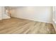 Open living room with hardwood floors and stairs leading upstairs at 10511 Boudreaux St, Huntersville, NC 28078