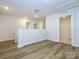 Spacious loft area with wood-look flooring and ample natural light at 10511 Boudreaux St, Huntersville, NC 28078