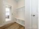 Convenient mudroom with built-in bench, cubbies, and hooks at 10511 Boudreaux St, Huntersville, NC 28078