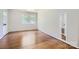 Bright bedroom featuring hardwood floors, neutral paint, and natural light at 3245 Minnesota Rd, Charlotte, NC 28208