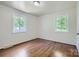 Bright bedroom featuring hardwood floors, neutral paint, and natural light at 3245 Minnesota Rd, Charlotte, NC 28208