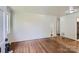 Spacious living room featuring hardwood floors, neutral paint, and natural light at 3245 Minnesota Rd, Charlotte, NC 28208