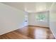 Bright living room featuring hardwood floors, neutral paint, and natural light at 3245 Minnesota Rd, Charlotte, NC 28208