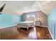 Bright bedroom with a unique wallpaper accent, hardwood floors and plenty of space at 7876 Rebecca Rd, Denver, NC 28037