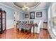 Elegant dining room with stylish decor, wood floors, and great natural light, perfect for hosting at 7876 Rebecca Rd, Denver, NC 28037