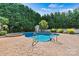 Beautiful in-ground pool and hot tub surrounded by a stamped concrete patio at 7876 Rebecca Rd, Denver, NC 28037