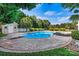 Large in-ground pool with diving board, shed, and stamped concrete patio at 7876 Rebecca Rd, Denver, NC 28037