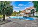 Backyard swimming pool with a diving board and landscaped surroundings, perfect for outdoor enjoyment at 7876 Rebecca Rd, Denver, NC 28037