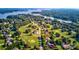 Aerial view of neighborhood with tree-lined streets and golf course and lake access at 332 Canvasback Rd, Mooresville, NC 28117