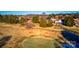 Aerial view of a golf course with a home nearby at 332 Canvasback Rd, Mooresville, NC 28117