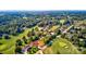 Aerial view of neighborhood with tree-lined streets and golf course access at 332 Canvasback Rd, Mooresville, NC 28117